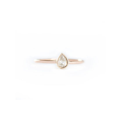 14k gold pear shape diamond engagement ring in bezel set