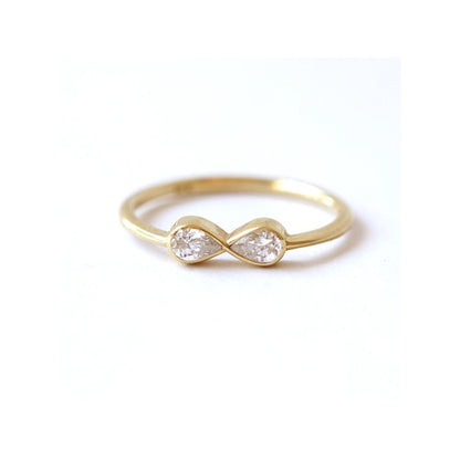 Diamond Infinity Symbol Ring In 14k Gold With Two 0.15 Carat Pear Cut Diamonds.